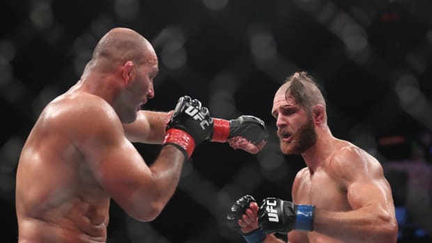 Glover Teixera (red gloves) fights Jiri Prochazka (blue gloves) during UFC 275 at Singapore Indoor Stadium.